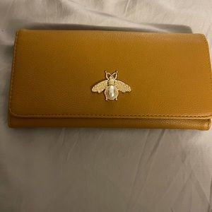 Tan/mustard wallet with bumble bee